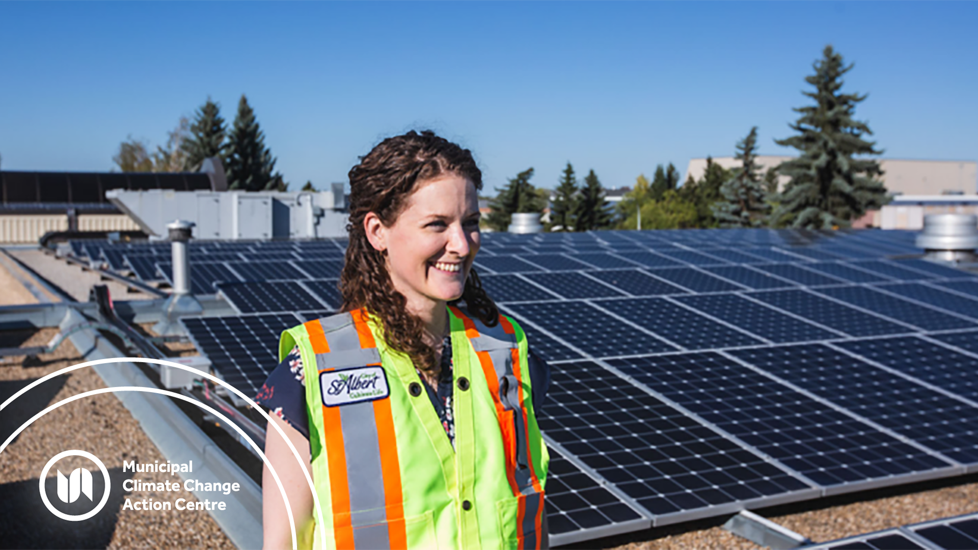 Woman standing in front of solar panels